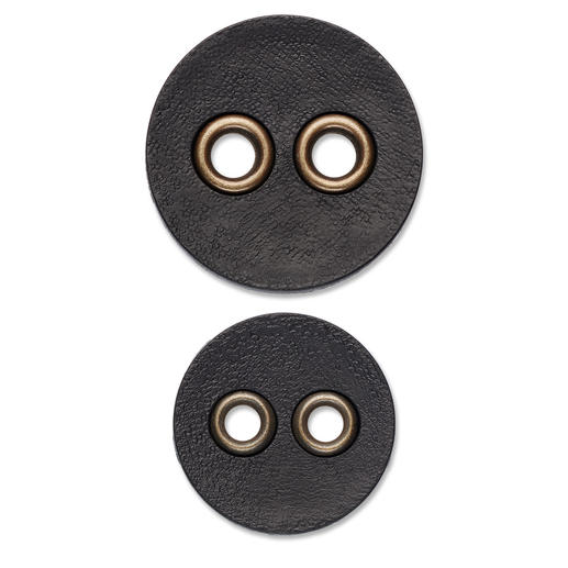 Schwarzer Vintageknopf aus Kunststoff mit zwei Löchern.