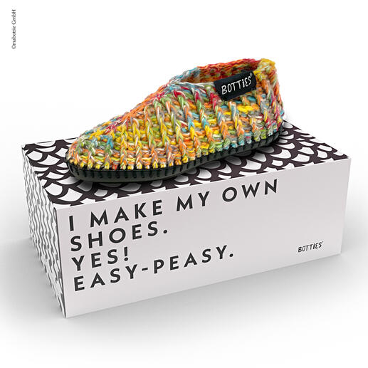 Starter-Set mit bunten Häkelbotties auf Verpackung.