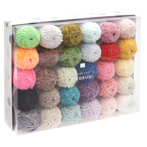 Dreißig bunte Wolle in einer transparenten Box.