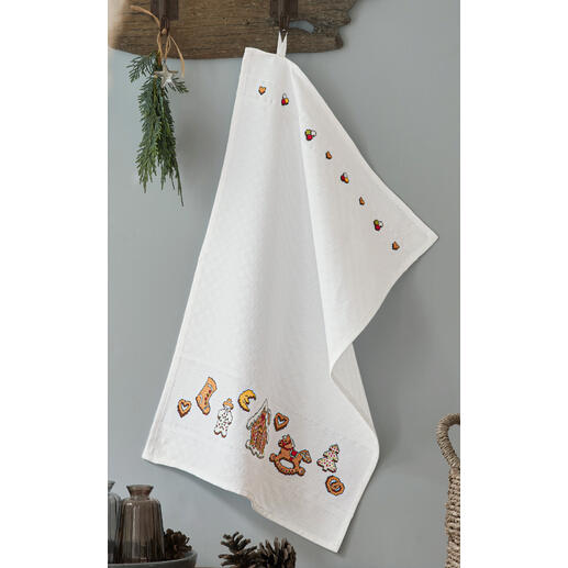 Geschirrtuch mit lebkuchenförmigen Motiven an der Kante