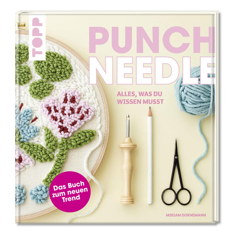 Buch über Punch Needle mit Anleitung und Materialien im Bild.