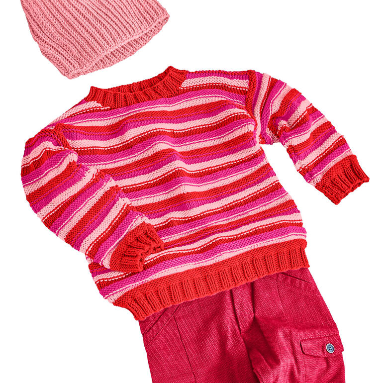 Gestreifter Kinderpullover aus Merino-Cotton in Rot- und Rosatönen.