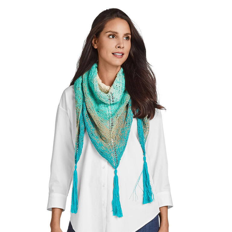 Türkisfarbenes Tuch mit Quasten und filigranem Muster.