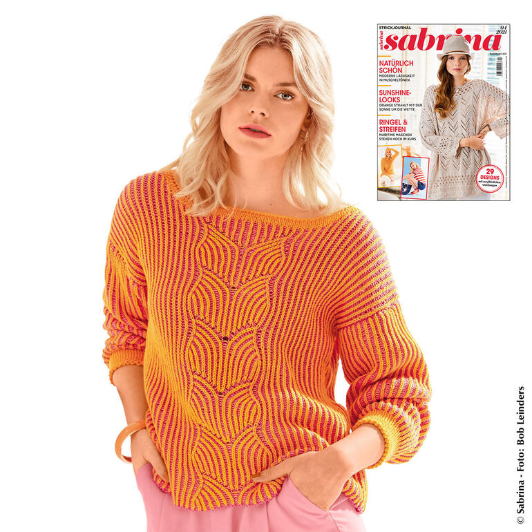 Pullover aus Cotonia II in gelb und orange, lächelnd getragen von einer Frau.