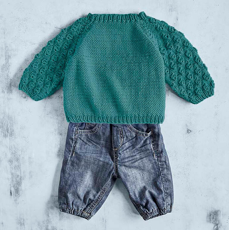 Babypulli aus Merino-Cotton in Türkis mit langen Ärmeln und Struktur.