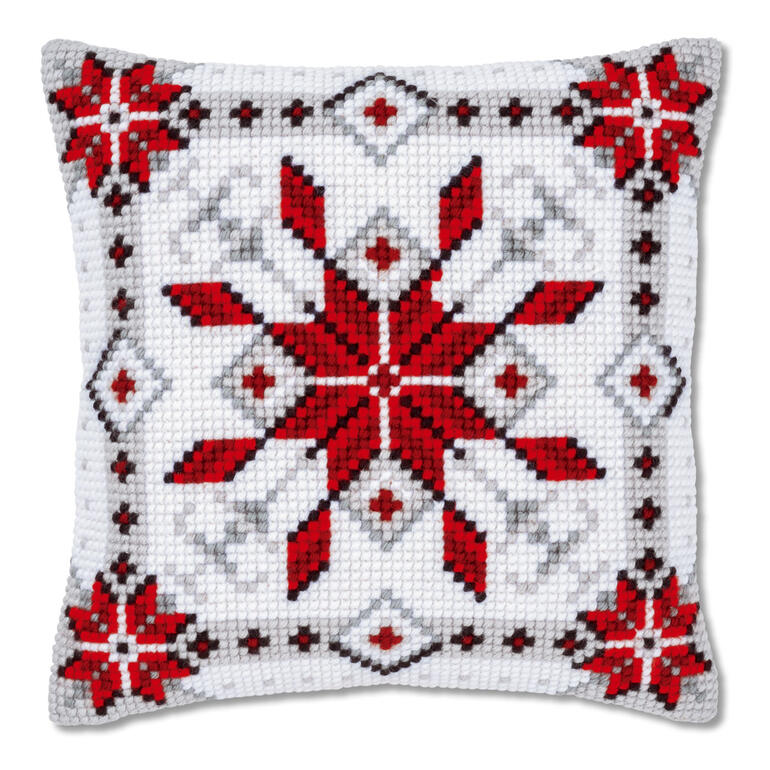 Kreuzstichkissen mit rotem Eiskristall auf weißem Hintergrund
