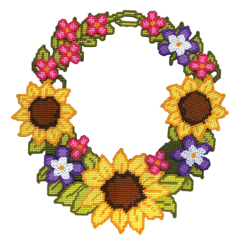 Wand-Deko in Form eines Kranzes mit bunten Blumen.